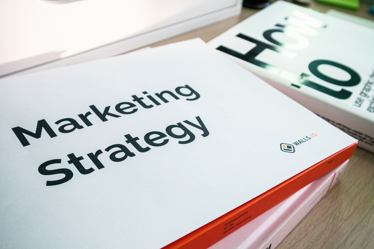 About A detailed view of marketing strategy documents with close focus on text, ideal for business and finance content.